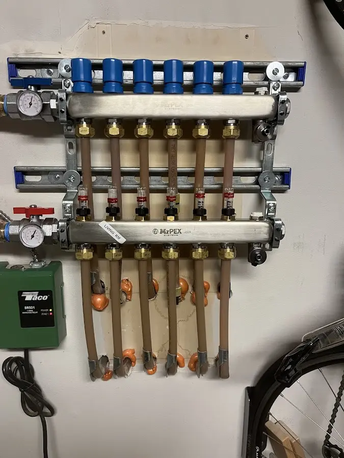 Plumber performing Water Heater Repair at a residential property in Gilmanton